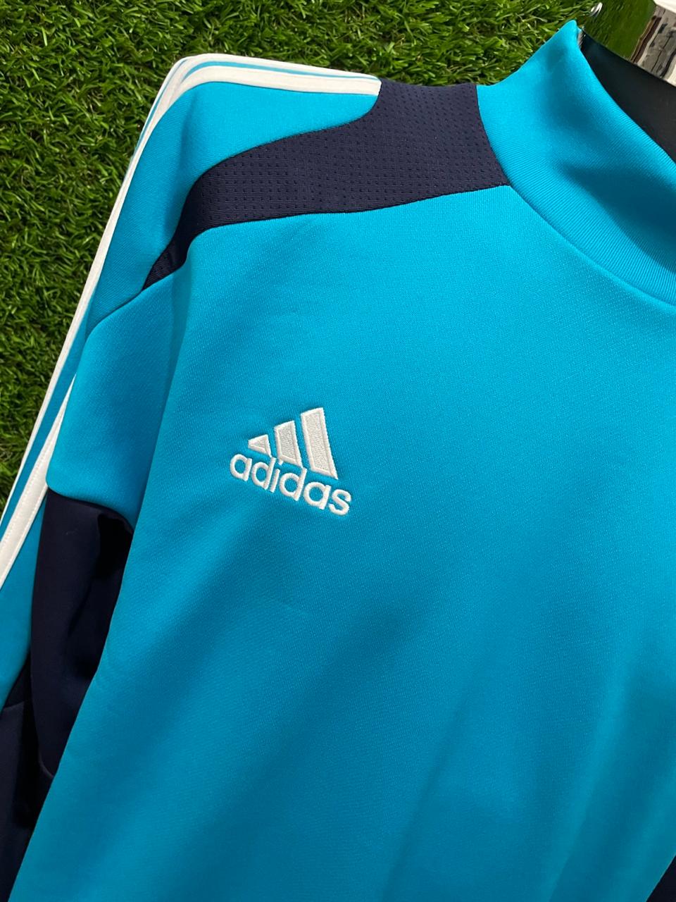 SUDADERA PREMATCH REAL MADRID UTILERIA
