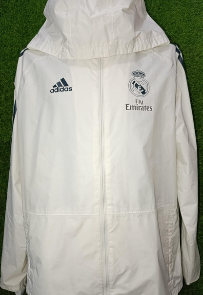 ROMPEVIENTOS REAL MADRID CON GORRO BLANCO